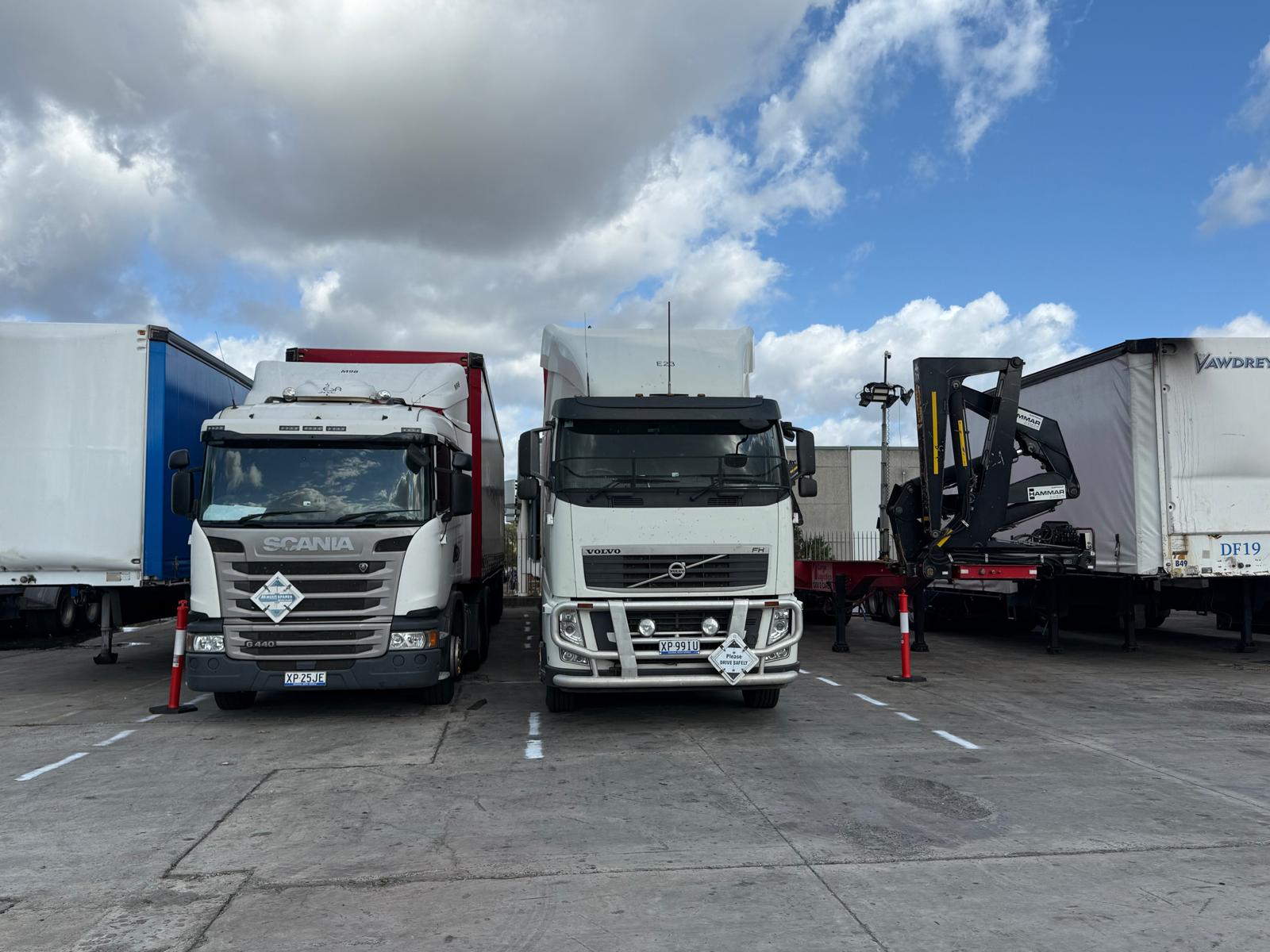 Truck transporting a shipping container on a highway